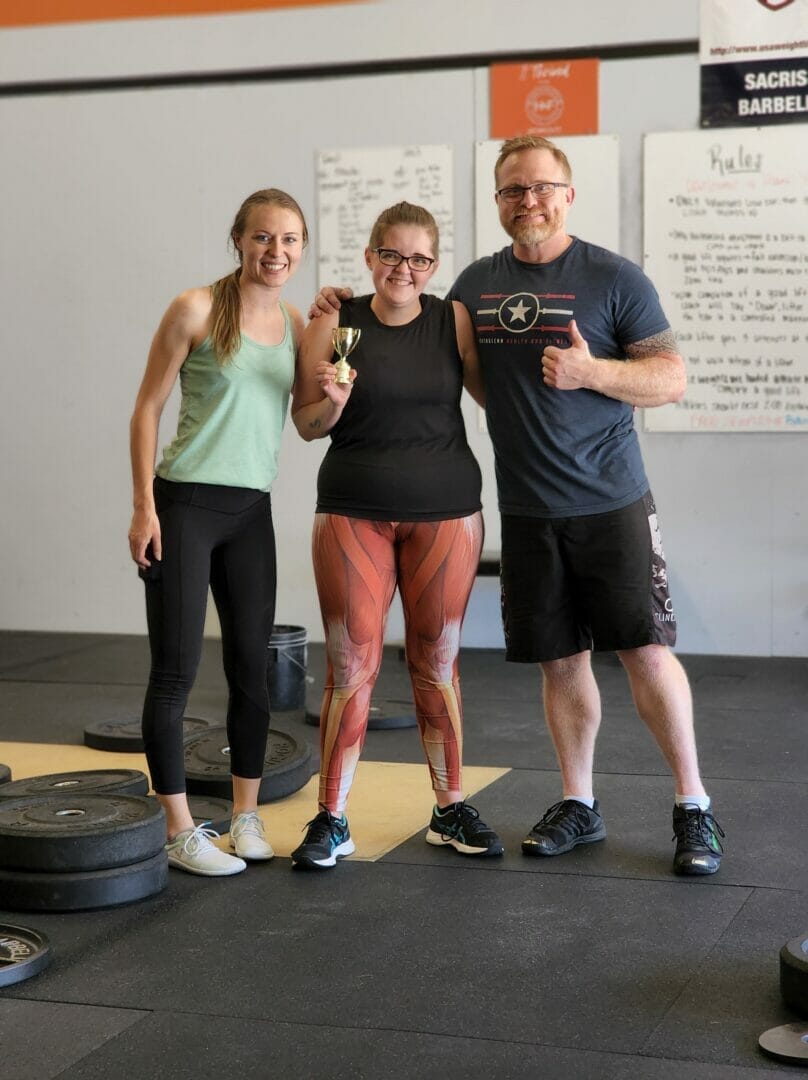 Meghan receiving her medal at the end of the 2022 NHF Deadlifts and Donuts