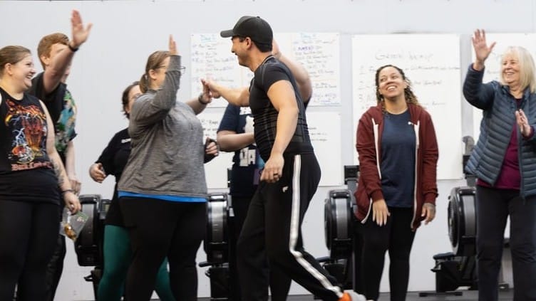 Northglenn Health and Fitness clients celebrating after a workout with high fives: a supportive and shame free fitness community for women over 30