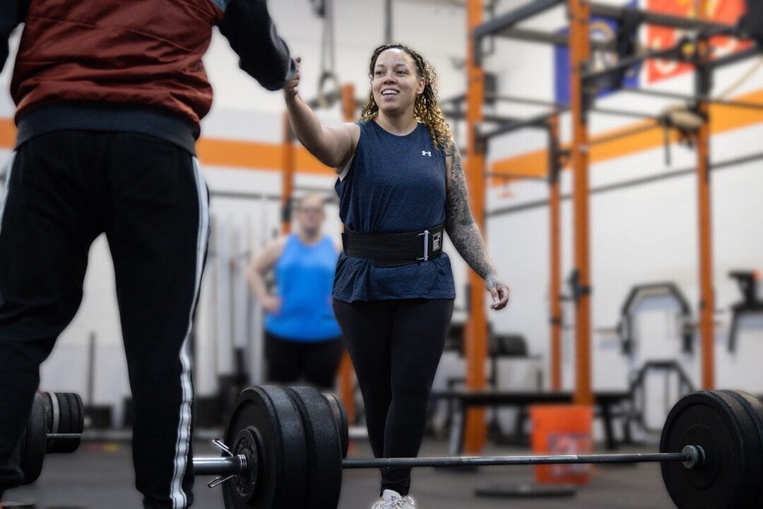 woman finishing a semi private personal training session at northglenn health and fitness