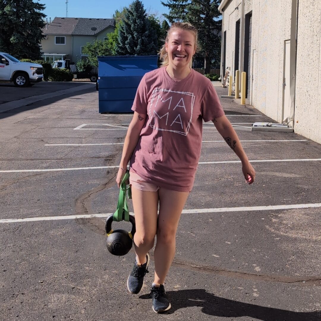 Woman at Northglenn Health and Fitness having fun doing Zone 2 cardio